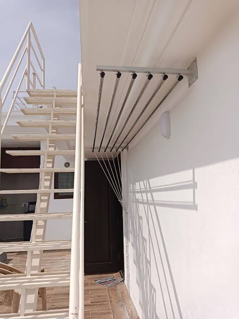 Wall-mount cloth hanger installed on a balcony in Chennai